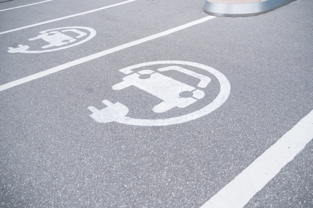 Sign,On,The,Pavement,Charging,For,Electric,Vehicles